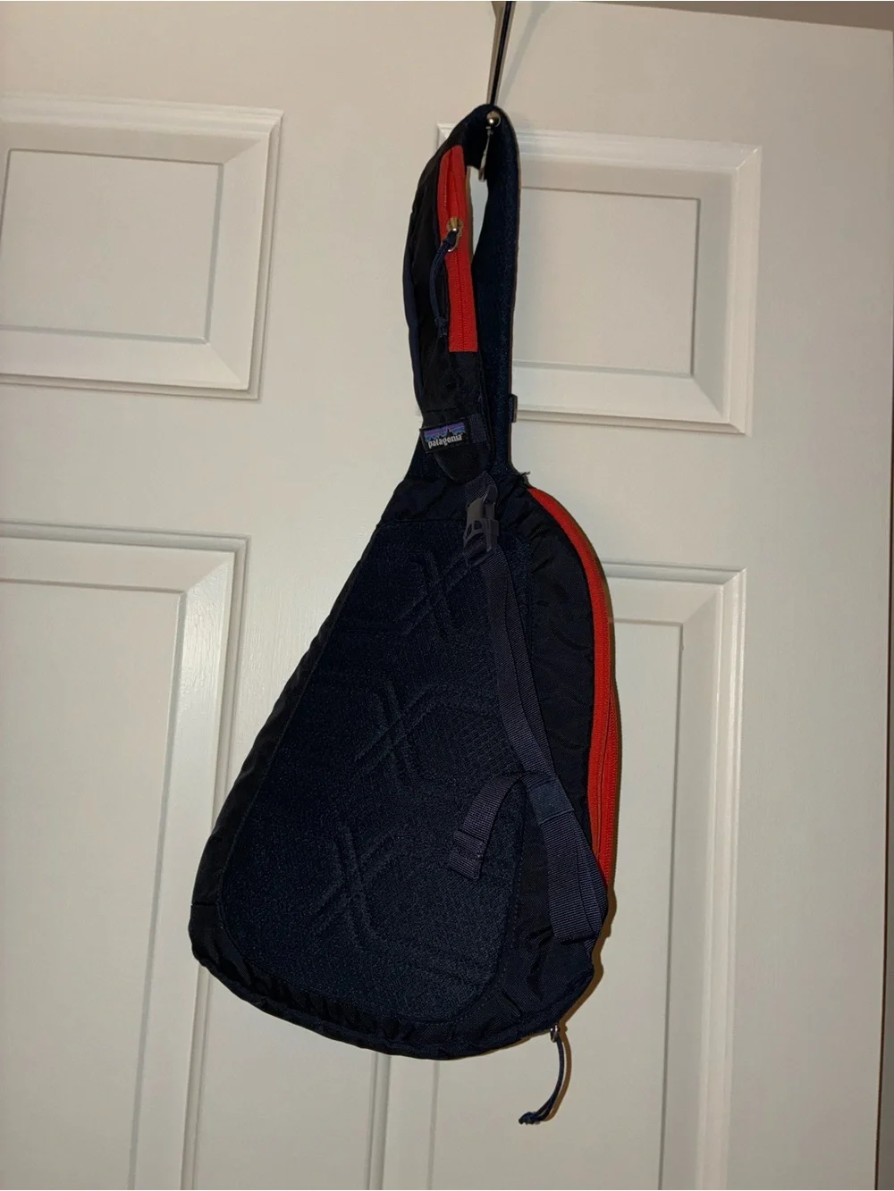 Patagonia Atom Sling 8L crossbody pack in a navy blue